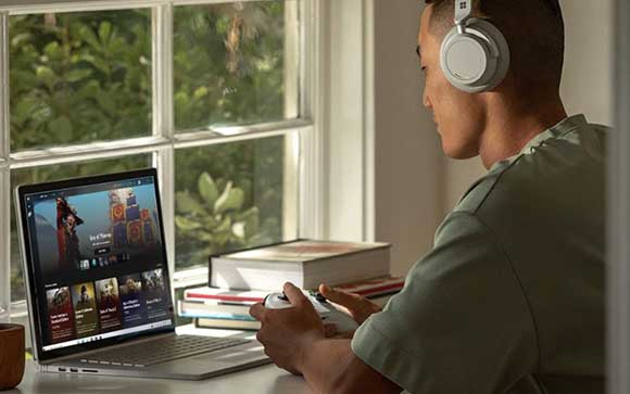 Young man using the Surface Book 3