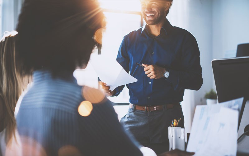 Overcome policy challenges Man presenting to colleagues