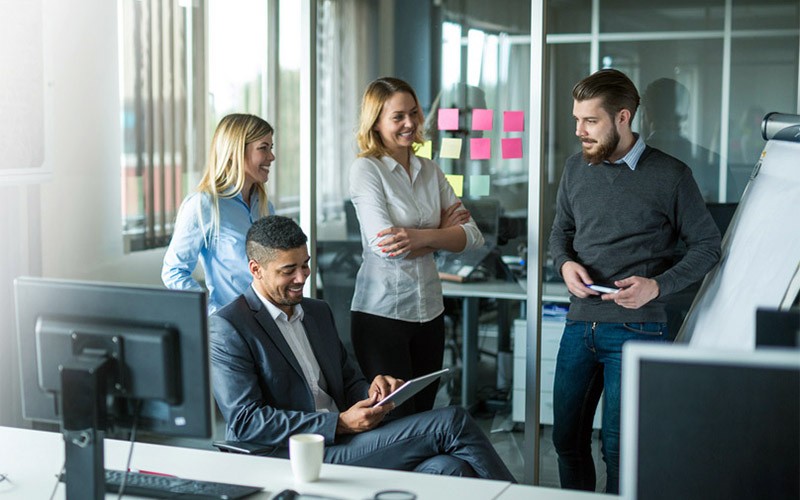 Protect your network Group of employees collaborating in tech office
