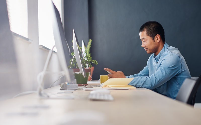 Gain the compliance you need to secure data access on any device, app or network Male working on monitor and desktop